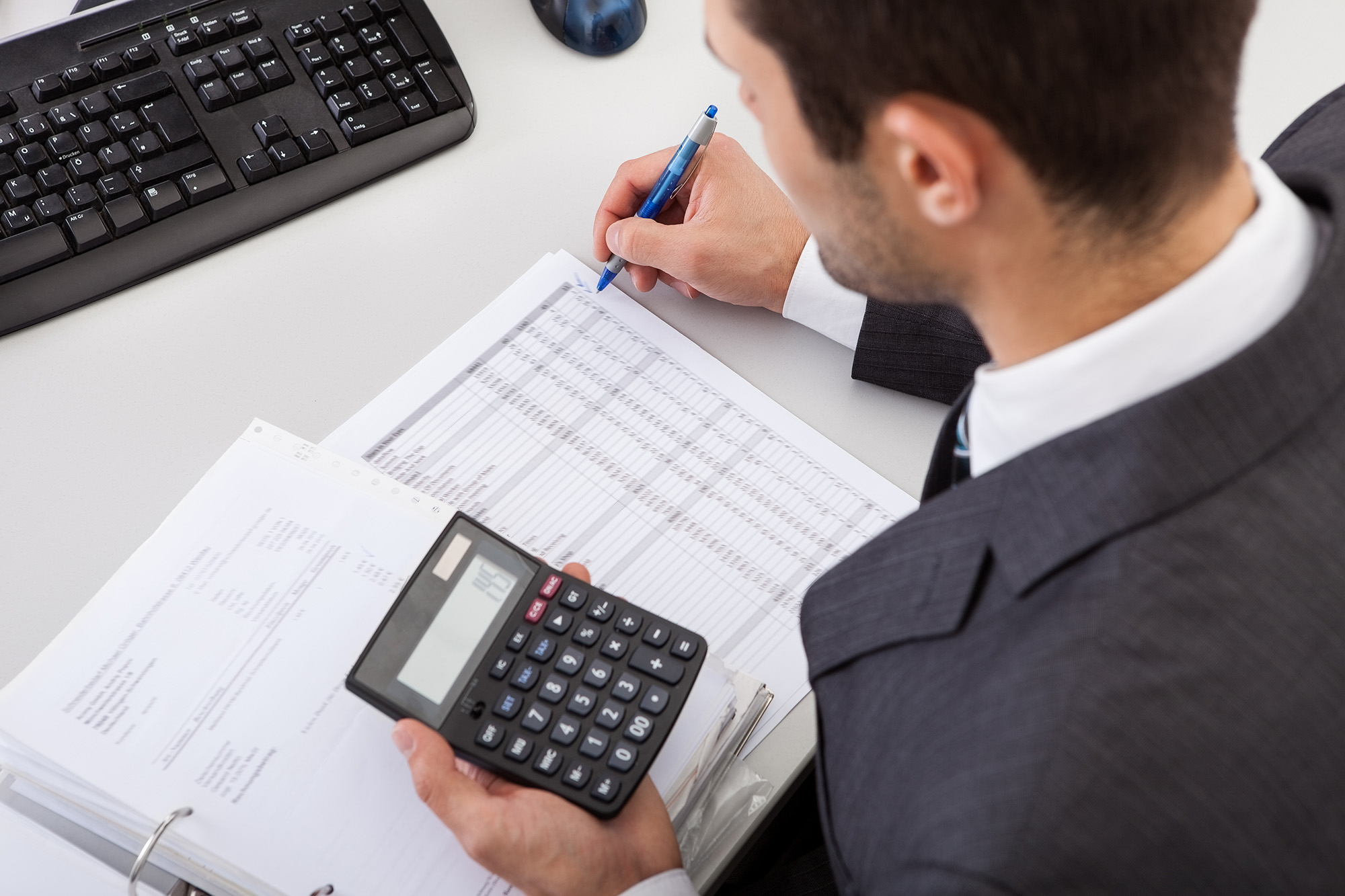 Accountant in suit working with financial data