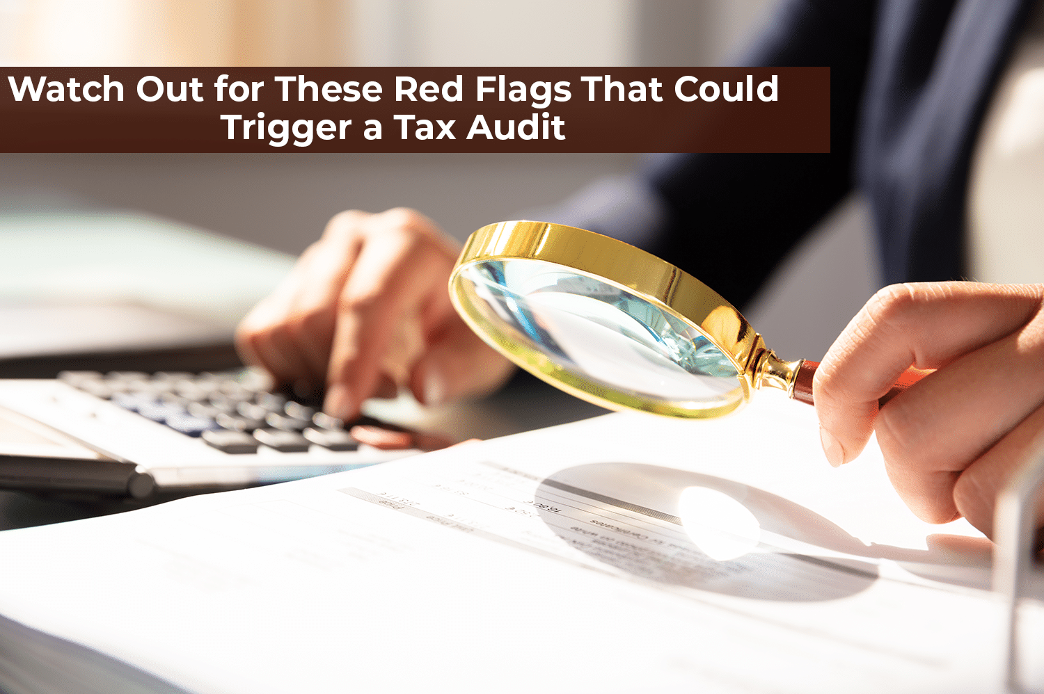 An anonymous IRS representative looking over a tax return with a magnifying glass, ready to start a tax audit.