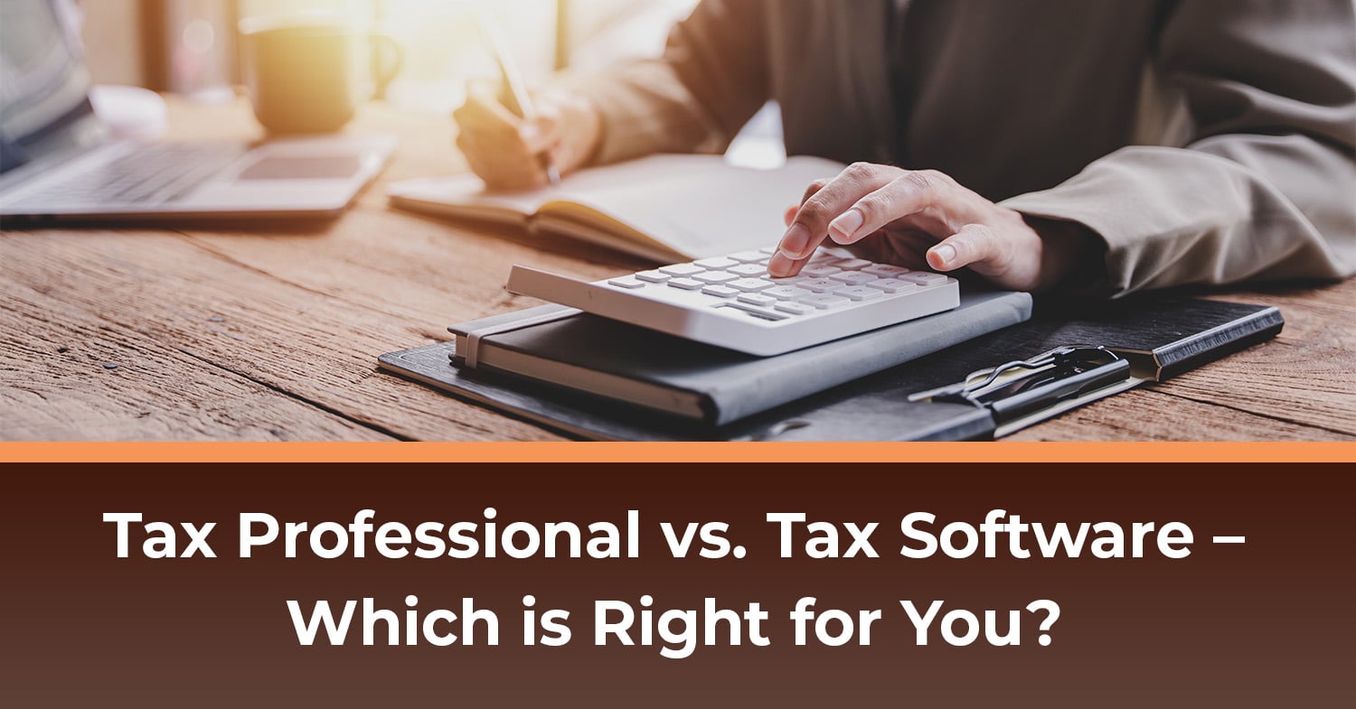 A man using a calculator and tax software to prepare his taxes.